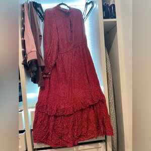 Long sleeve maxi dress with heart details. Tie neck. Ruffle sleeves